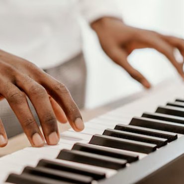 male-musician-playing-electric-keyboard_23-2148847024